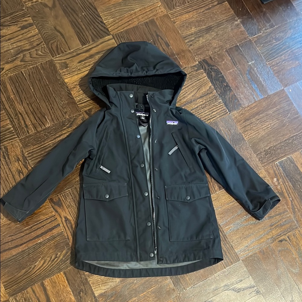 Patagonia Black Raincoat with Hood and Weather-Resistant Fabric